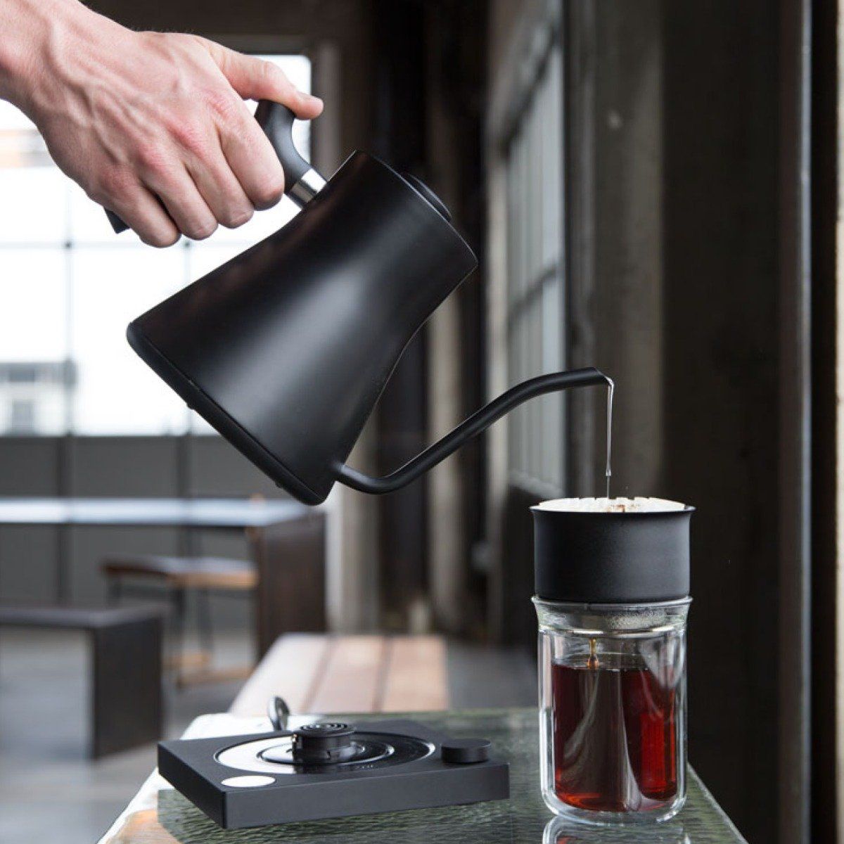 fellow kettle black pouring out